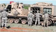 ??  ?? Troops with the 2nd Battalion, 4th Field Artillery prepare a Multiple Launch Rocket System at Fort Sill’s West Range during a live-fire exercise.