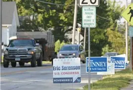  ?? ?? A campaign sign for 17th Congressio­nal District Democratic candidate Eric Sorensen is posted on 30th Street, Sept. 15 in Rock Island.