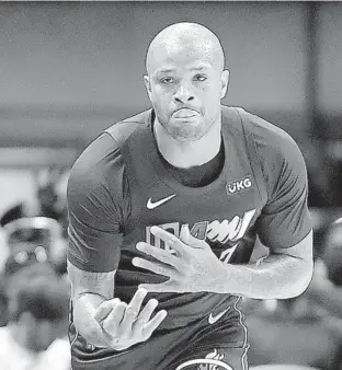  ?? MICHAEL LAUGHLIN / SUN SENTINEL ?? The Heat’s P.J. Tucker displays three fingers after hitting a 3-point shot against the Boston Celtics during the first half of their game Thursday.