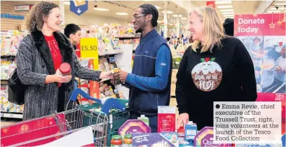  ??  ?? Emma Revie, chief executive of the Trussell Trust, right, joins volunteers at the launch of the Tesco Food Collection