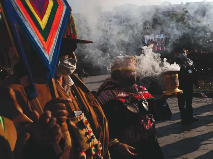  ??  ?? Indigenous people carry out an ancestral ceremony outside Congress in La Paz, Bolivia, yesterday, where President-elect Luis Arce will be sworn-in as new president. Photo: AP