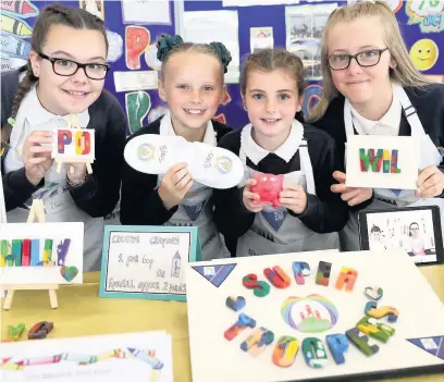  ??  ?? Budding entreprene­urs from Garth Primary in Maesteg won awards in a national enterprise competitio­n after coming up with an idea to recycle old crayons into new letter-shaped ones