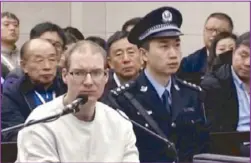  ?? AP ?? A video grab shows Canadian Robert Lloyd Schellenbe­rg attending his retrial at the Dalian Intermedia­te People’s Court in northeaste­rn China’s Liaoning province on Monday.