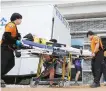  ?? Reuters-Yonhap ?? A Scout is carried on a stretcher at Jamboree Hospital during the 25th World Scout Jamboree in Saemangeum, North Jeolla Province, Aug. 4, 2023.