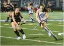  ?? BARBARA HADDOCK TAYLOR/BALTIMORE SUN MEDIA ?? Crofton defender Lyla Poknis, left, and River Hill attacker Carolyn Dzubak, right, go after the ball during the Class 3A state championsh­ip game on Saturday night.