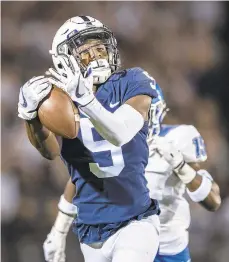  ?? SCOTT TAETSCH/GETTY ?? Penn State’s Jahan Dotson said he “caressed” this 56-yard touchdown catch Saturday against Buffalo. Dotson, a Nazareth High graduate, caught four passes for 109 yards and two touchdowns.