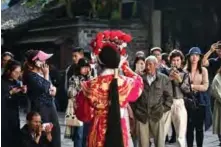  ??  ?? People watch a Beijing Opera performanc­e during the 7th annual Wuzhen Theatre Festival in Wuzhen in Zhejiang province.