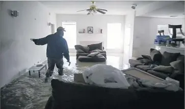  ?? Robert Gauthier Los Angeles Times ?? A FLOODED home in the Houston suburb of Clodine. A national forecastin­g firm estimated total damages of between $81 billion and $108 billion, which would make Harvey the second-costliest storm in U.S. history.