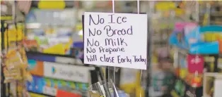  ?? DAVID GOLDMAN/ASSOCIATED PRESS ?? A message greets shoppers of supplies no longer available Thursday in the island town of Nichols, S.C., as Hurricane Florence approaches the East Coast.