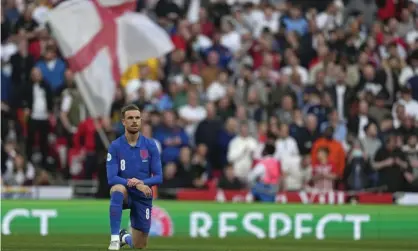  ?? ?? Jordan Henderson takes the knee before England’s friendly with Switzerlan­d at Wembley on Saturday. Photograph: Alastair Grant/AP