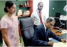  ??  ?? Senarath Bandara performs his first task after assuming the new position as General Manager and Chief Executive Officer of Bank of Ceylon in the presence of his wife Manori