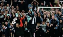  ?? ?? Newcastle United’s Saudi Arabian chairman Yasir Al-rumayyan leads the celebratio­ns after the team qualified for the Champions League. — reuters