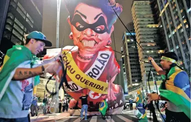  ?? PICTURE: AP ?? BIG MOTHER: Anti-government demonstrat­ors set up a large inflatable doll of Brazil’s president, Dilma Rousseff, wearing a presidenti­al sash inscribed with the words in Portuguese ‘Goodbye dear’ and ‘Mother of Big Oil’, in São Paulo, Brazil.