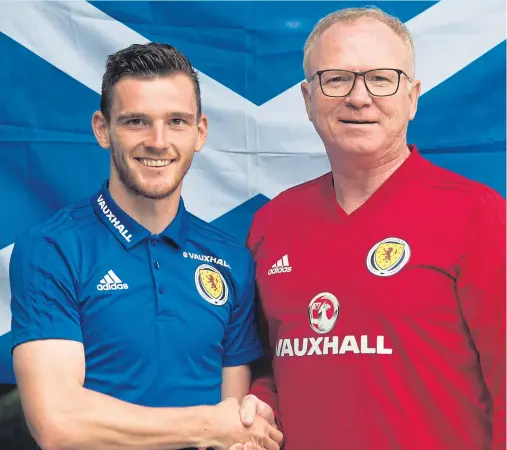  ?? Picture: SNS Group. ?? Andy Robertson with boss Alex McLeish after being named Scotland’s new captain.