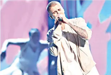  ??  ?? Justin Bieber performs at Ariana Grande’s closing Coachella set.