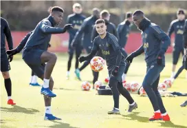  ??  ?? From left: Manchester United’s Paul Pogba, Andreas Pereira and Eric Bailly during training in Manchester yesterday, on the eve of their UEFA Champions League match against PSG. — Reuters