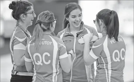  ?? CP PHOTO ?? Quebec skip Emilia Gagne, middle, shares a laugh with her team at the Scotties Tournament of Hearts this week.