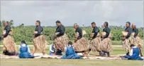  ?? Photo: MARK
TAYLOR/ FAIRFAX NZ ?? Greeting: Tongans pay their respects as the body of King Tupou V arrives in Nuku’alofa.