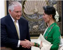  ?? AP ?? Aung San Suu Kyi greets Rex Tillerson at the Foreign Ministry office in Naypyitaw, Myanmar, on Wednesday. —