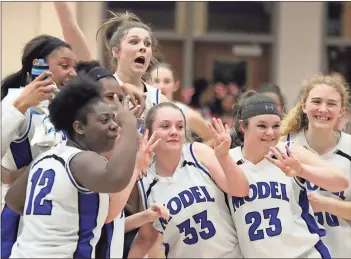  ?? Jeremy Stewart / RN-T ?? Model’s Libby Upton leaps behind her teammates after Model’s 79-63 win Tuesday over Dodge County.