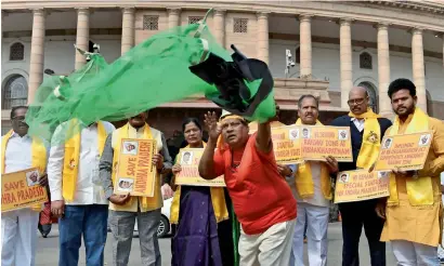  ?? — PTI ?? TDP MP Naramalli Sivaprasad, dressed as a fisherman, along with other leaders protests demanding a special status for the state of Andhra Pradesh, during the Budget Session of Parliament in New Delhi on Friday.