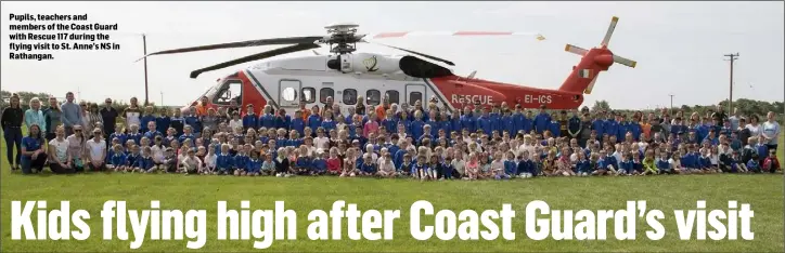  ??  ?? Pupils, teachers and members of the Coast Guard with Rescue 117 during the flying visit to St. Anne’s NS in Rathangan.