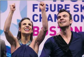  ?? — GETTY IMAGES ?? Canadians Meagan Duhamel and Eric Radford react after hearing their winning score in the pairs free skate at the world figure skating championsh­ips at TD Garden in Boston Saturday.