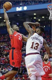  ?? VAUGHN RIDLEY / GETTY IMAGES ?? Raptors forward Kawhi Leonard goes up for a shot over Cavaliers forward Tristan Thompson in Wednesday’s season opener in Toronto.