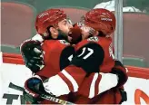  ?? ROB SCHUMACHER/THE REPUBLIC ?? The Coyotes’ Alex Galchenyuk (17) receives a hug after scoring in Tuesday’s 5-1 win over the Senators. Recap, 5C