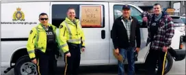  ?? Photo contribute­d ?? Team members, Const. Carlos Rojas, Const. Dan Carson, Const. Brad Smith and Sgt. Mark Booth of the Kelowna RCMP Municipal Traffic Section stand alongside one of the vehicles used by the Kelowna RCMP to spot distracted drivers in Kelowna. The vehicle...