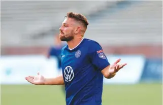  ?? STAFF PHOTO BY DOUG STRICKLAND ?? The Chattanoog­a Football Club’s Alun Webb shrugs following his goal during a match against Asheville City FC at Finley Stadium on June 29. CFC’s season is about the resume despite the demise of the NPSL’s planned pro division.