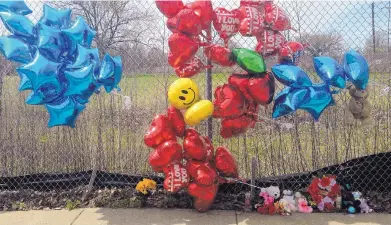  ?? MIKE HOUSEHOLDE­R/ASSOCIATED PRESS ?? A makeshift memorial sits near where Robert Godwin Sr., 74, was killed Sunday in Cleveland.