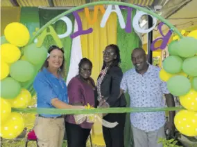  ?? ?? Executive director of the Sandals Foundation Heidi Clarke (left); education officer for Region 4, Susan Sims; principal of Pell River Primary School, Sherine Clarke; and Revern Grant pose for the ribbon cutting ceremony for the peace garden at the institutio­n.