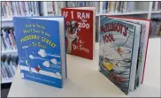 ??  ?? Copies of “And to Think That I Saw It on Mulberry Street,” “If I Ran the Zoo,” and “McElligot’s Pool,” three of the books by Dr. Seuss that will no longer be published, are part of the collection at the Wyomissing Public Library.