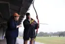  ?? Photograph: Jessica Hromas/The Guardian ?? Archery instructor Virasha runs Jennifer Wong through the basics.