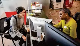  ?? Melissa Phillip/Staff photograph­er ?? Laura Alvarado, a junior, left, talks with financial aid adviser Joy McHenry at the University of Houston Welcome Center on April 10.