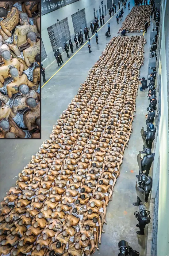  ?? Pictures: AFP ?? Inhuman: With bowed, shaved heads, prisoners are crammed together at Tecoluca watched by guards in riot gear