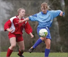  ??  ?? Cara McDonald (North End United) beats Kayla Farrell ( Bunclody A.F.C.) to the ball in their recent meeting in Drinagh.