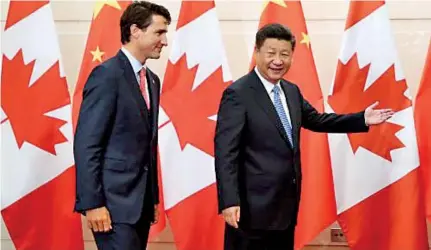  ??  ?? From left: Canadian Prime Minister Justin Trudeau with Chinese President Xi Jinping