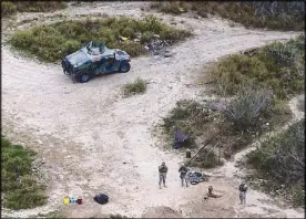  ?? AP ?? This file photo shows members of the National Guard on patrol along the Texas-Mexico border in Rio Grande City, Texas.