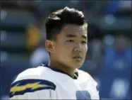  ?? JAE C. HONG — THE ASSOCIATED PRESS FILE ?? In this file photo, Los Angeles Chargers kicker Younghoe Koo stands on the field during an NFL football training camp at StubHub Center in Carson. Younghoe Koo knew nothing about football until lunch recess in the seventh grade in New Jersey. The South...
