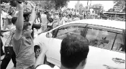  ?? Express ?? BJD workers protest near Gangwar’s car on Friday.
