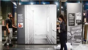  ??  ?? PHILADELPH­IA: Elizabeth Tinker and Noah Smalls install an exhibit at the African American Museum in Philadelph­ia.