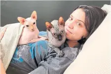  ?? JULIA ROMANO ?? Julia Romano, sister of Toronto Blue Jays pitcher Jordan Romano, often features her two sphinx cats, Jojo and Raisin, in her popular TikTok videos.