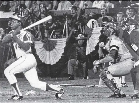  ??  ?? This famous swing by Hank Aaron was immortaliz­ed in a bronze statue created in 1982 by Ed Dwight, who was just beginning his artistic career. Ultimately, 527 fans gave to the nonprofit establishe­d to pay for the statue, with an average donation of...