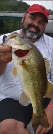  ?? (Arkansas Democrat-Gazette/Bryan Hendricks) ?? Mark Shatley of Camden caught the biggest fish of the day Monday on Lower White Oak Lake in Ouachita County on a shaky head worm.