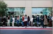  ?? ARIANA DREHSLER — GETTY IMAGES ?? Long lines form at the San Diego Voter Registrar’s Office as people wait to register to vote Tuesday.