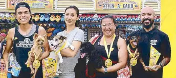  ??  ?? Brad Feliciano with his Yorky Kaya, Emily Rojas with her Jack Russell Terrier Tasha, Jenny Serrada with her Cocker Spaniel India and Joe Claret with his Mini Pin Max