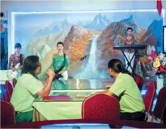  ?? AP-Yonhap ?? North Korean waitresses perform at the Pyongyang Okryu-Gwan Restaurant in Dubai, the United Arab Emirates, July 25.