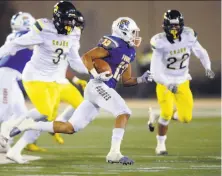  ?? Eric Taylor / 1st String ?? Serra tailback Isiah Kendrick (13) runs for daylight against Cajon-San Bernardino. Kendrick scored four times in the win.